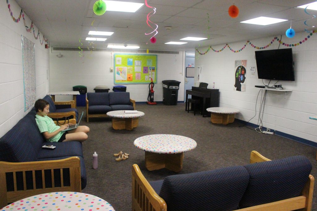 Couches and tables in residence hall common room