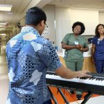 Student pianist performs at a hospital