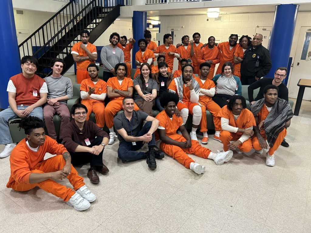 Group photo of Program Poetic Justice program volunteers and participants